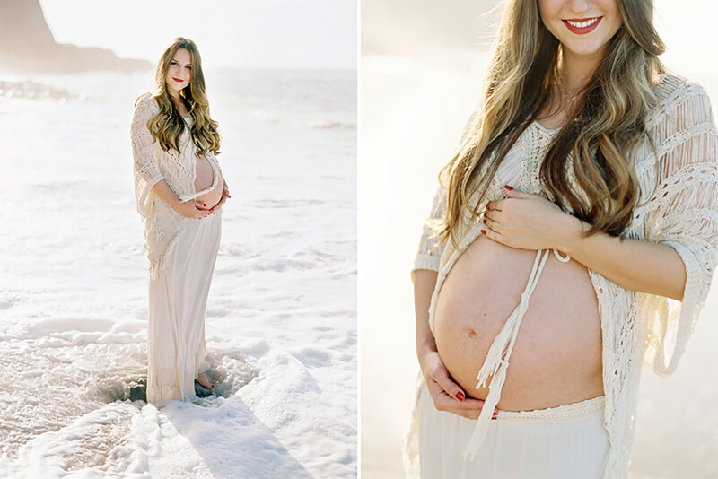 An expectant mother wearing a white dress holding her belly iduring her beach maternity session