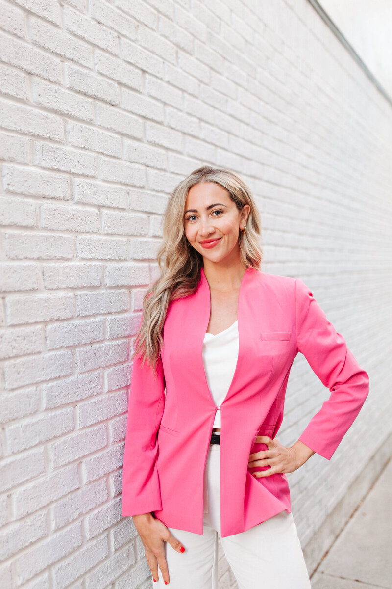 Natalie Jones in a blue jean suit smiling in a branding headshot