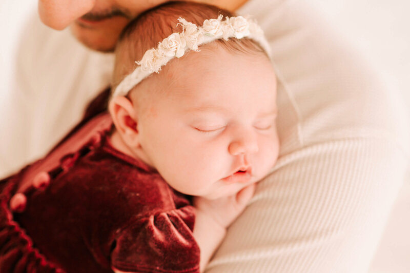 baby girl sleeping on dads shoulder captured by newborn photographer in Springfield MO Jessica Kennedy of The XO Photography