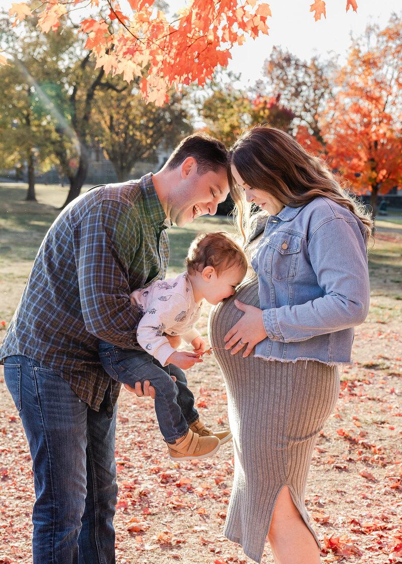 Lifestyle maternity family photo at a park in Essex County, NJ