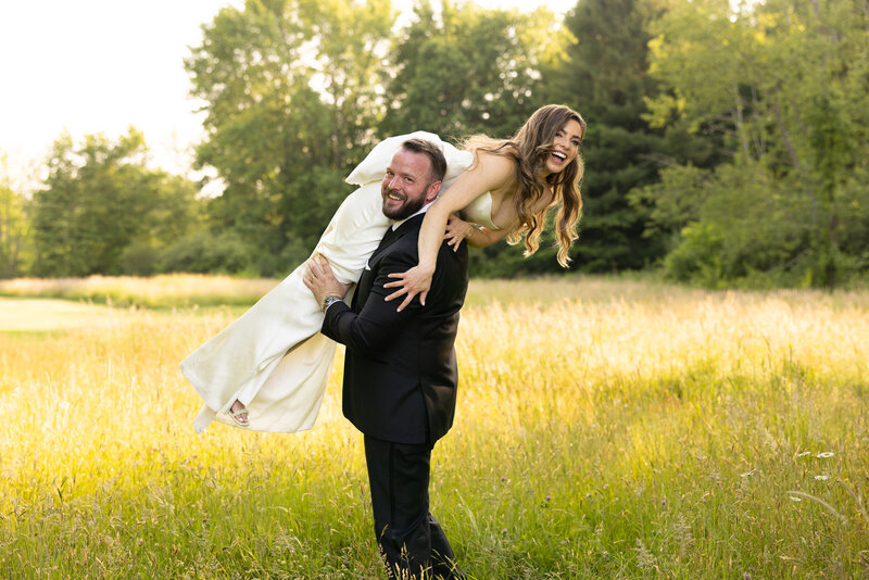 a bride and groom embrace one another during their couples portraits on their wedding day in Bracesville, Ohio. A true love story. Friends of more than 20 years before dating. And now finally happily married! Wedding in Newton Falls, Ohio.Photo taken by Aaron Aldhizer