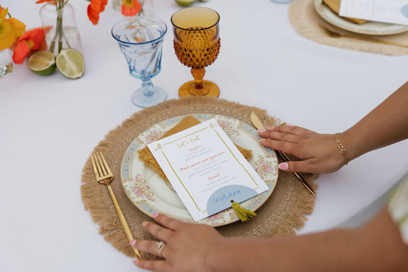 Editorial citrus wedding invitation suite flatlay with layered stationery