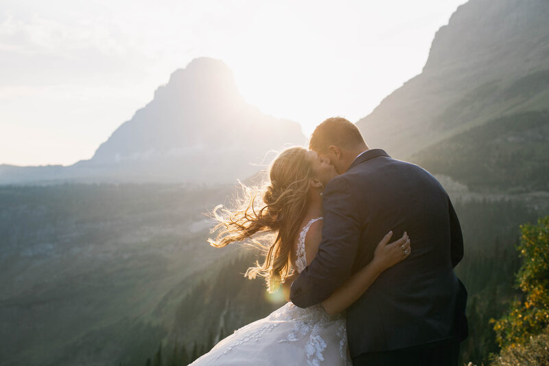 bride kissing groom on cheek