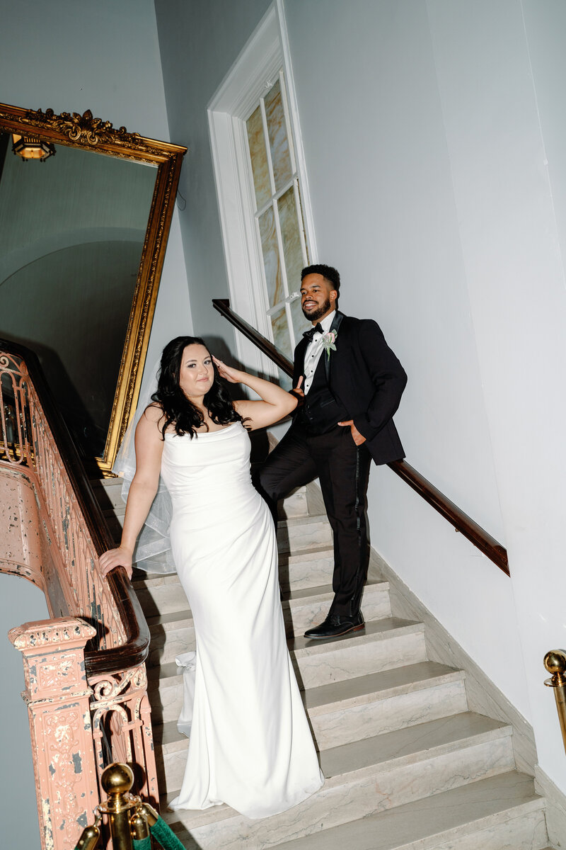 Couple posed on the stairs of The Line Hotel during their Summer DC Elopement