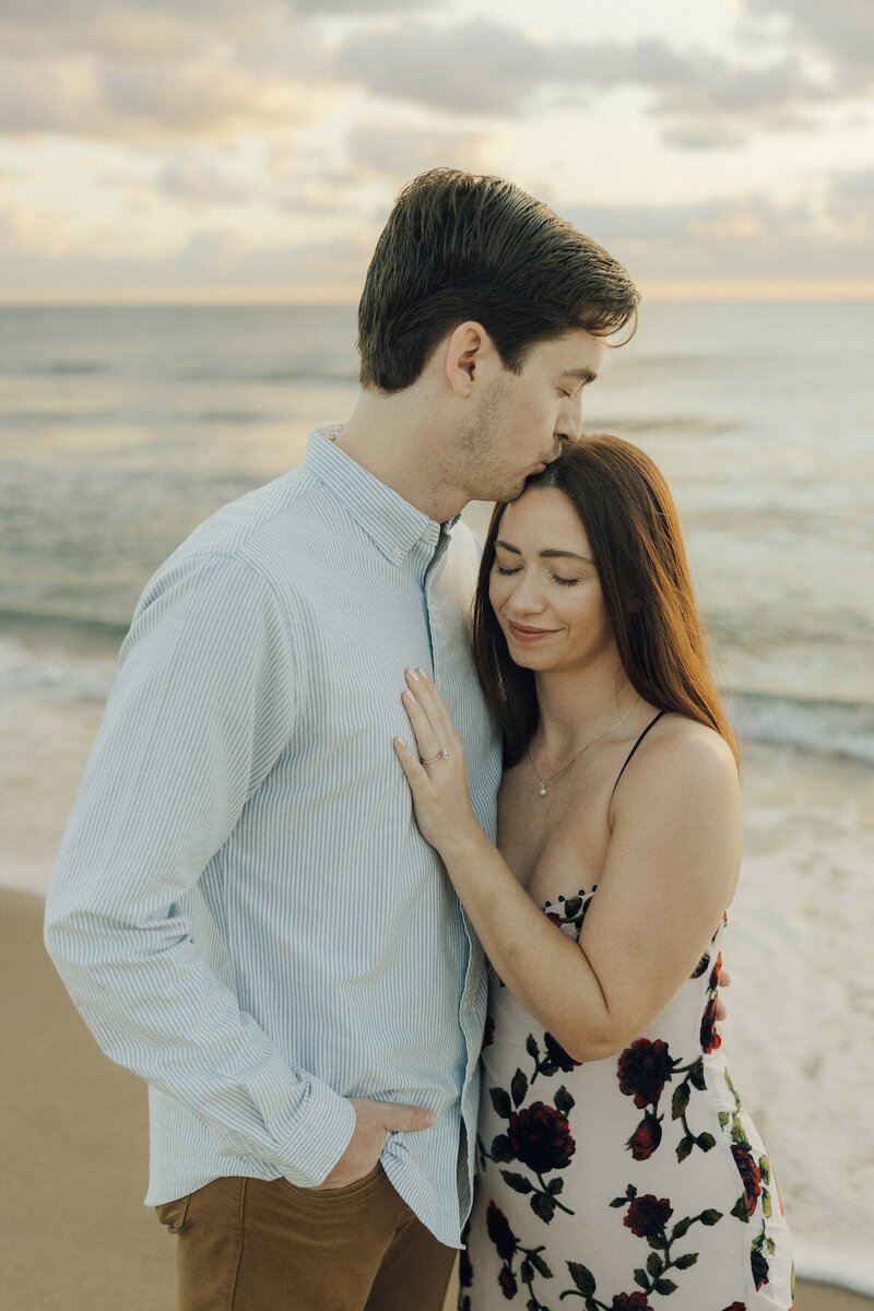 cristina pelino's portfolio image of couple embracing on the beach in south florida