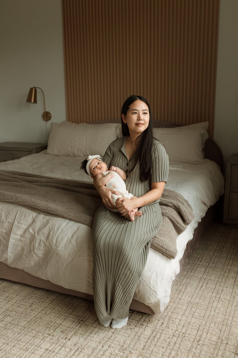 Mom holding her newborn in her arms