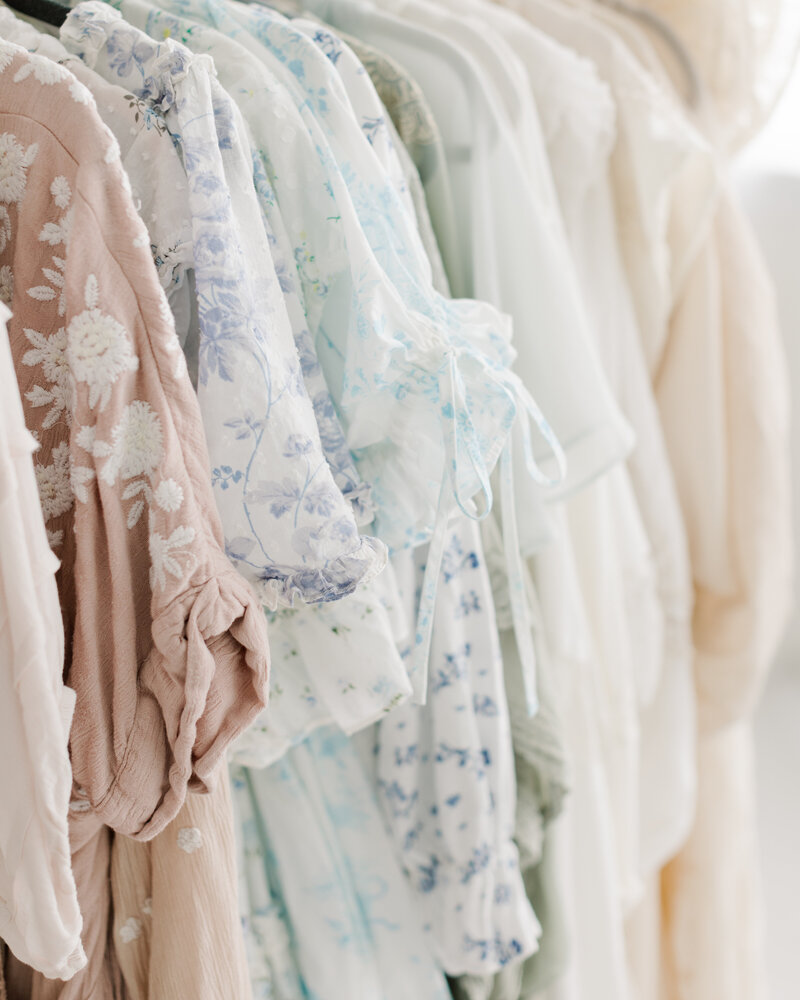 Closet filled with women's dresses for family portraits