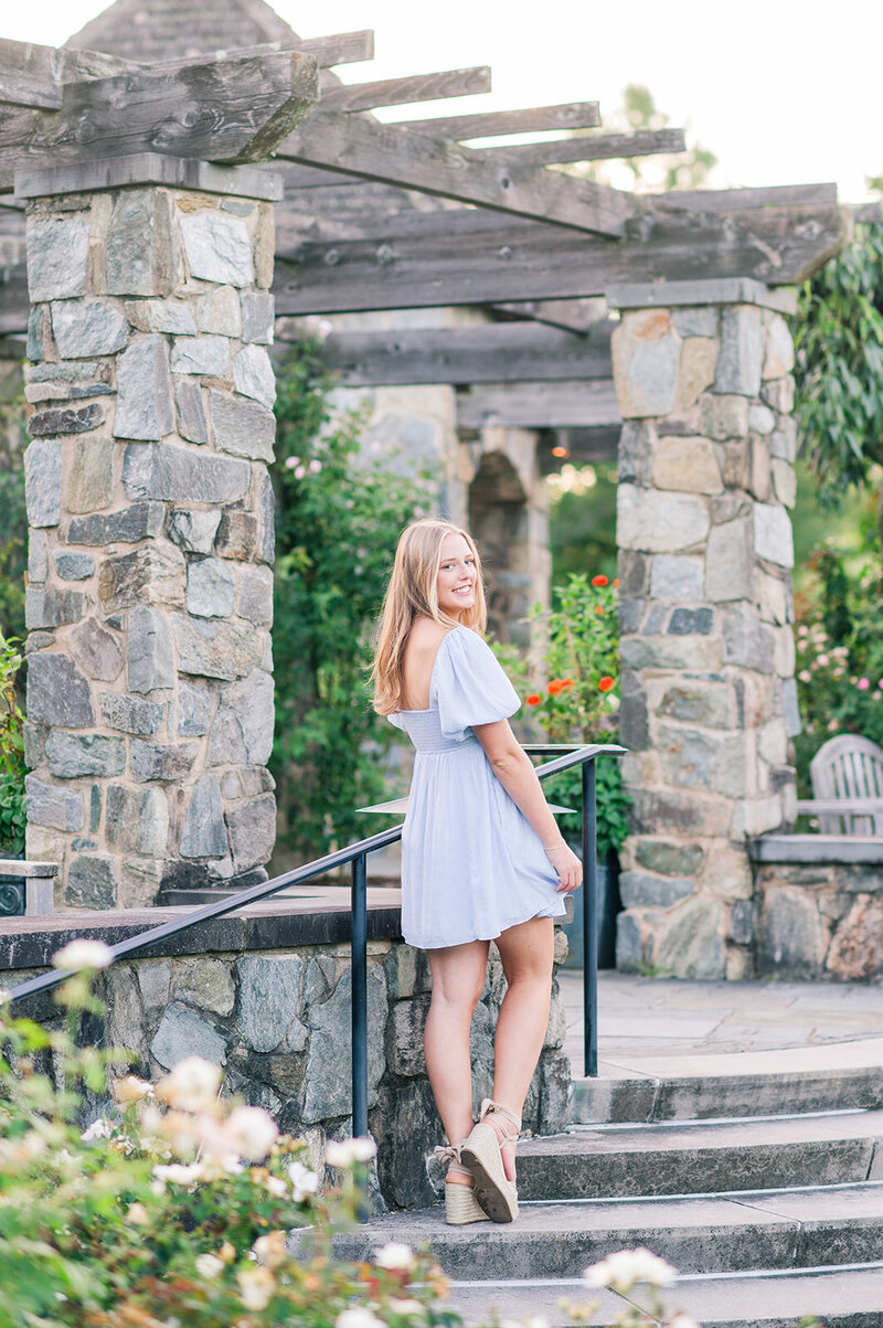 girl posing on stone steps