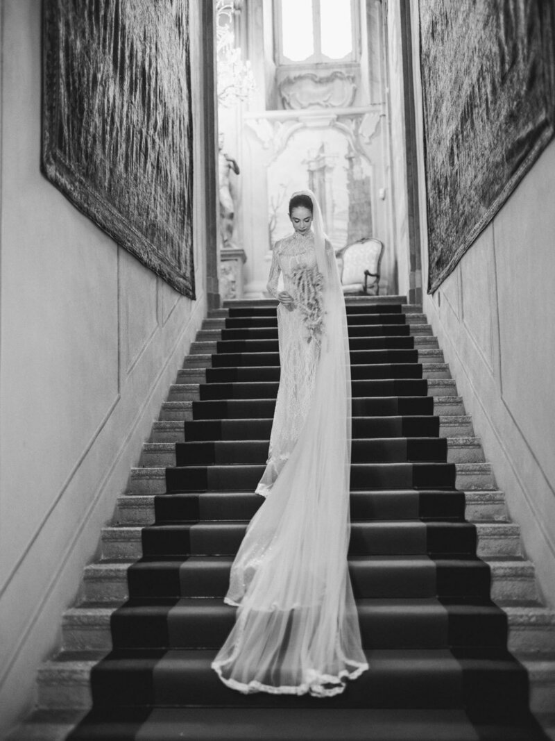Bride during her villa Sola Cabiati wedding, standing on staircase and wearing a Galia Lahav wedding dress, by Lake Como Wedding Photographer Andreas K. Georgiou