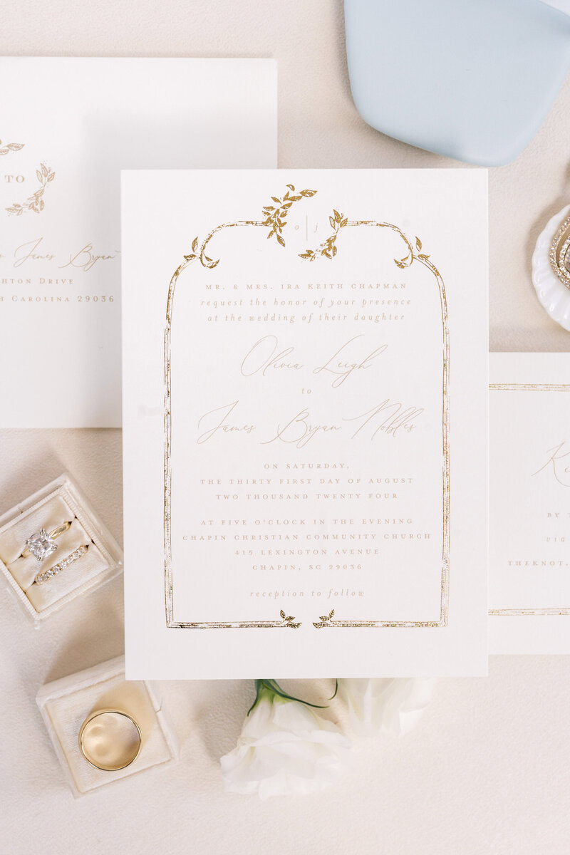 South Carolina Wedding Photographer | Photo of wedding invitation with wedding rings