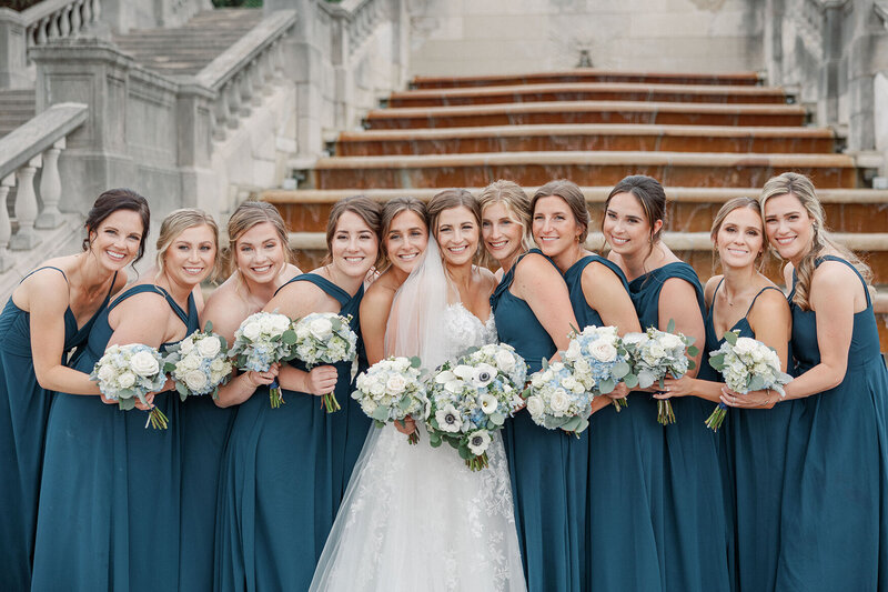 bridal party in front of steps