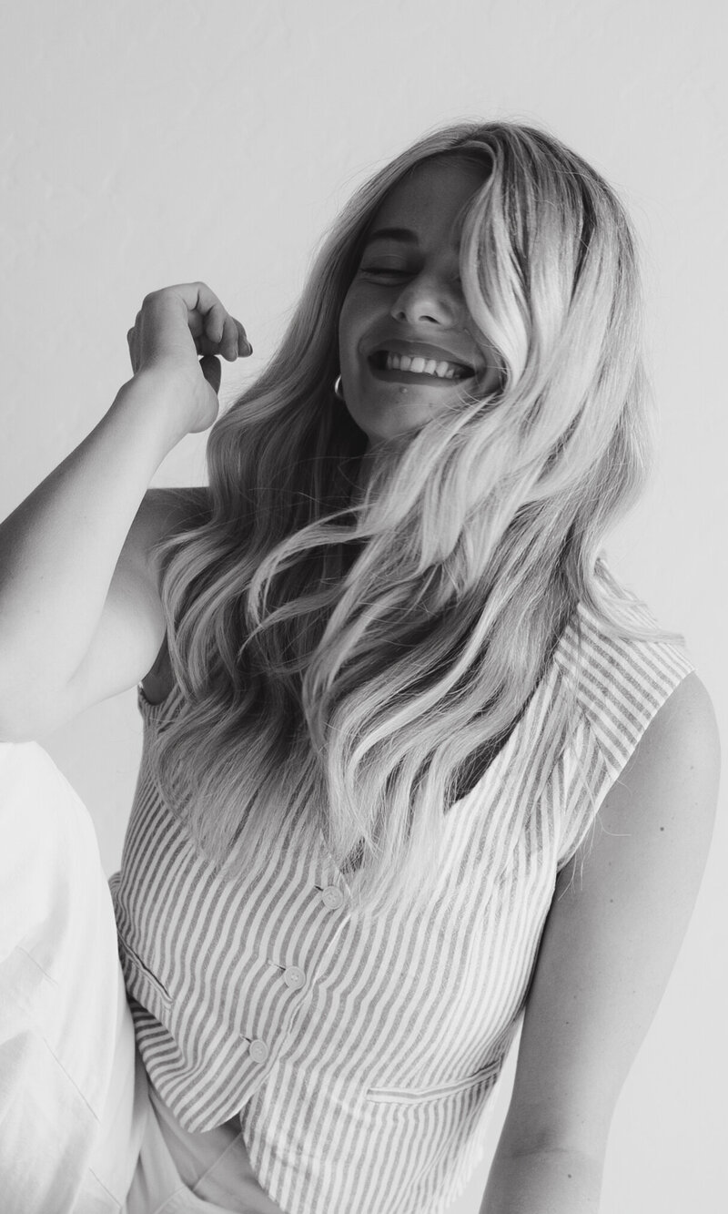 Denver wedding photographer laughs in the studio