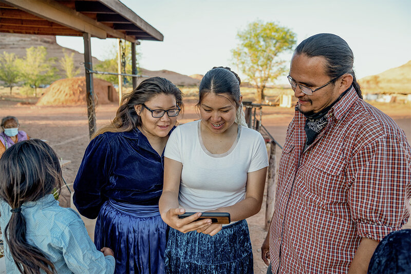 family looking at a phone