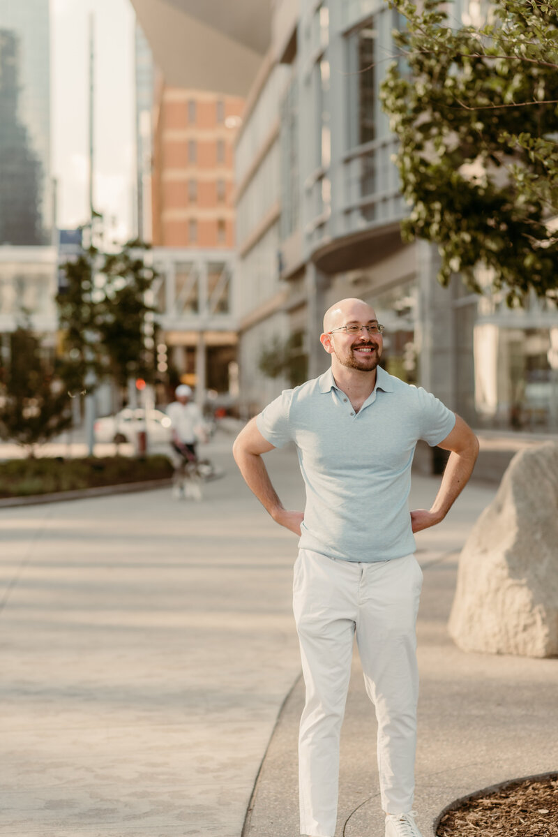 Man walking in downtown Minneapolis during dating photo session
