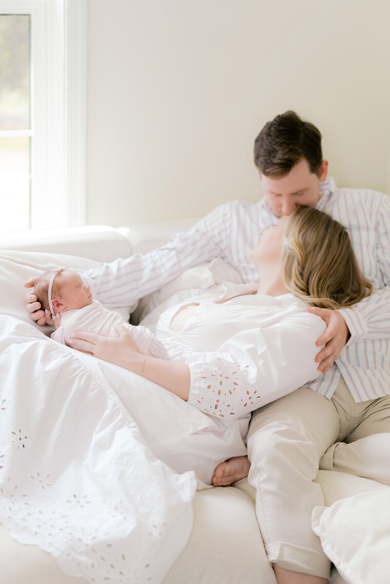 Bride and Groom holding hands standing in front of Eiffel Tower in Paris France.