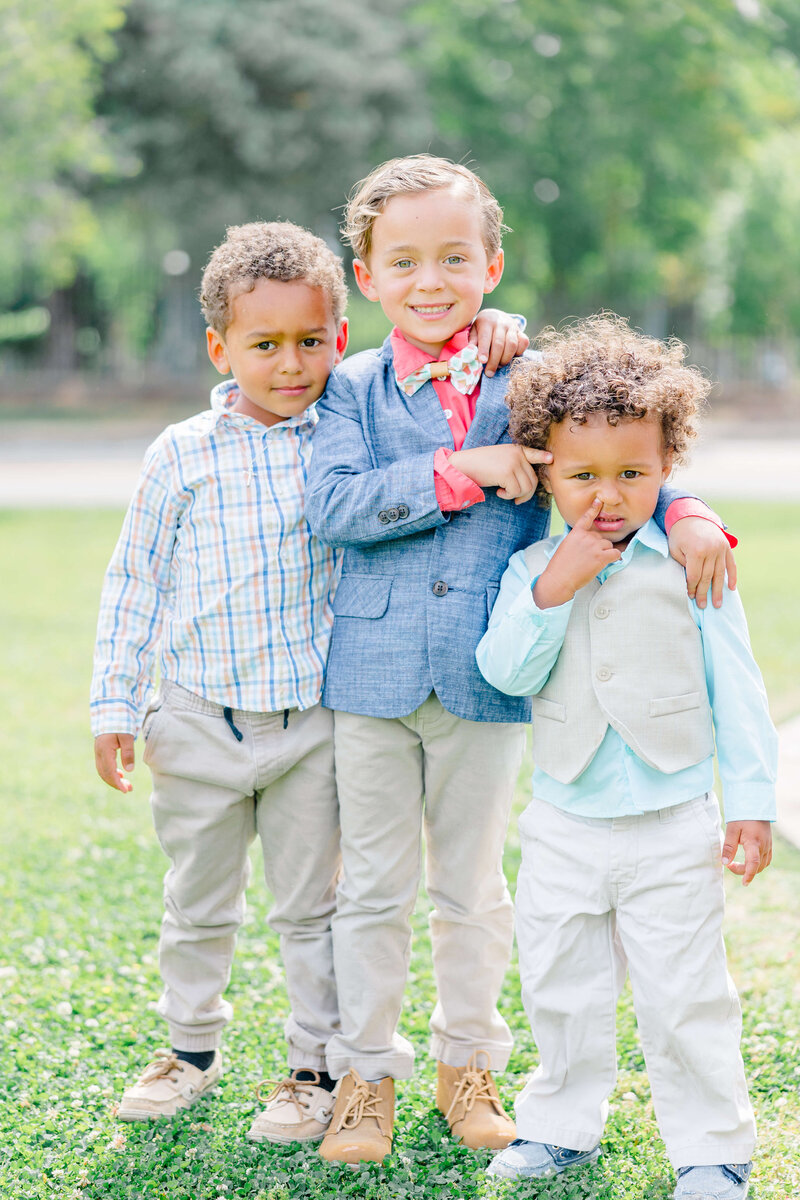 three children playing while having family photos taken in fayetteville nc