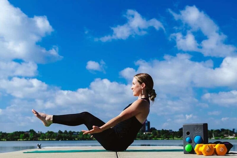 Devon Denys practicing a challenging yoga pose, emphasizing strength and flexibility as part of her wellness routine in Colorado.