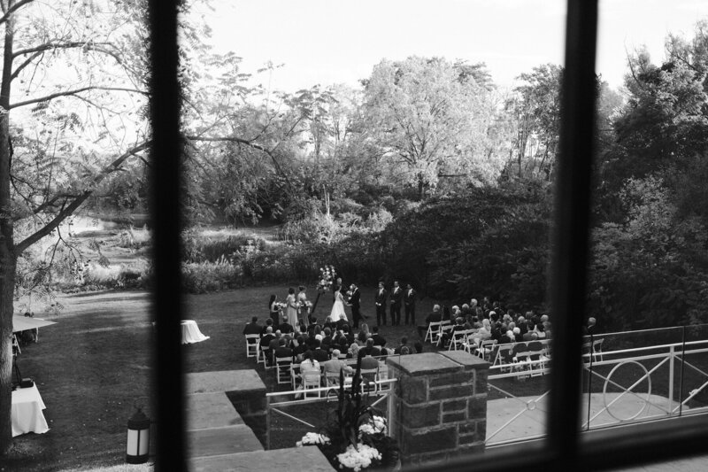 Black and white photo of wedding ceremony at Harding Waterfront Estate in Toronto