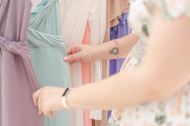 Hand holding on to dresses during branding photography in Manassas, VA