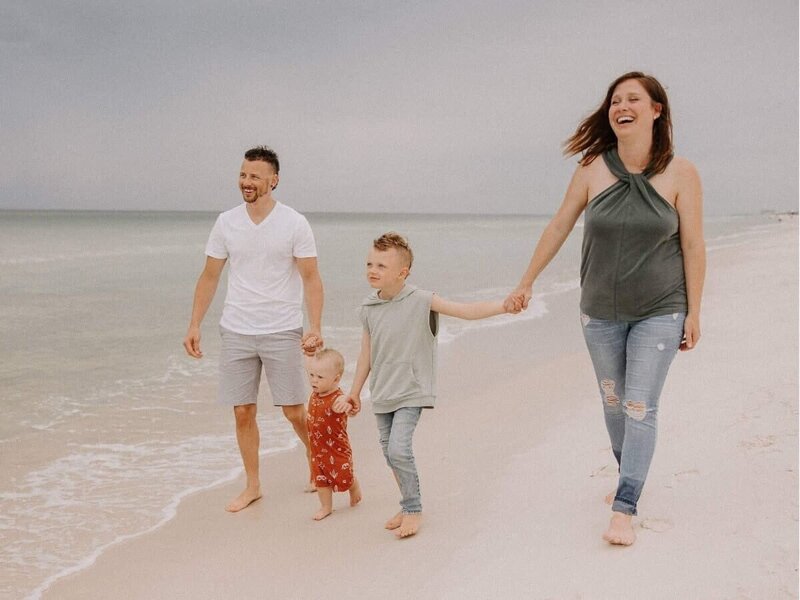Client experience strategist Caitlyn Gray with family at the beach