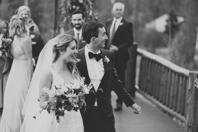 bride and groom smiling after getting married