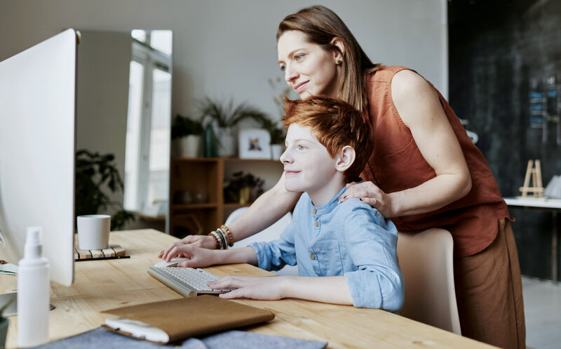 Mom and child doing virtual therapy together