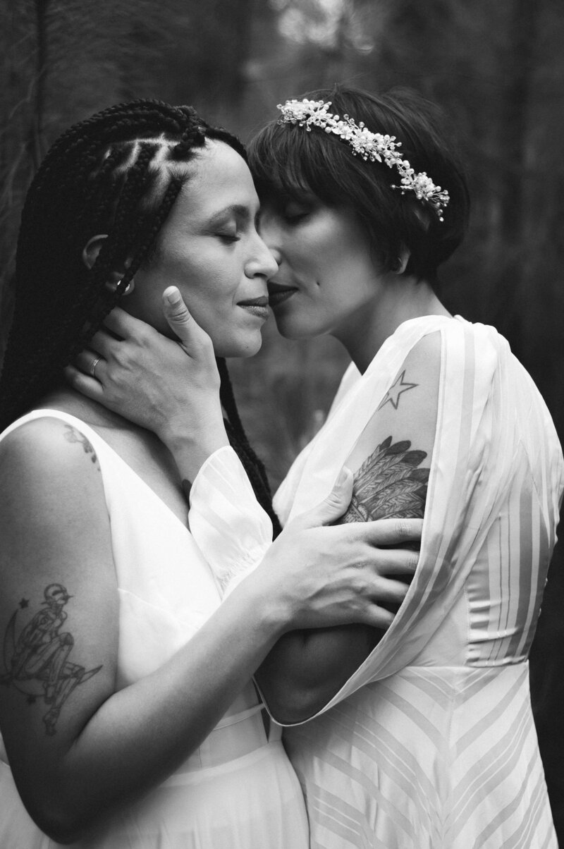 Two women brides embracing, representing the inclusive nature of the Crush Collective wedding show.