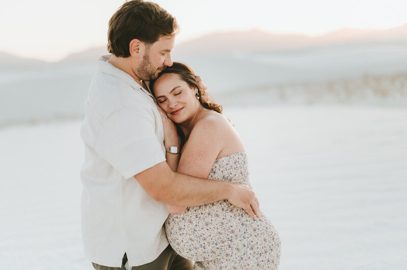 Woman hugging man in White Sands