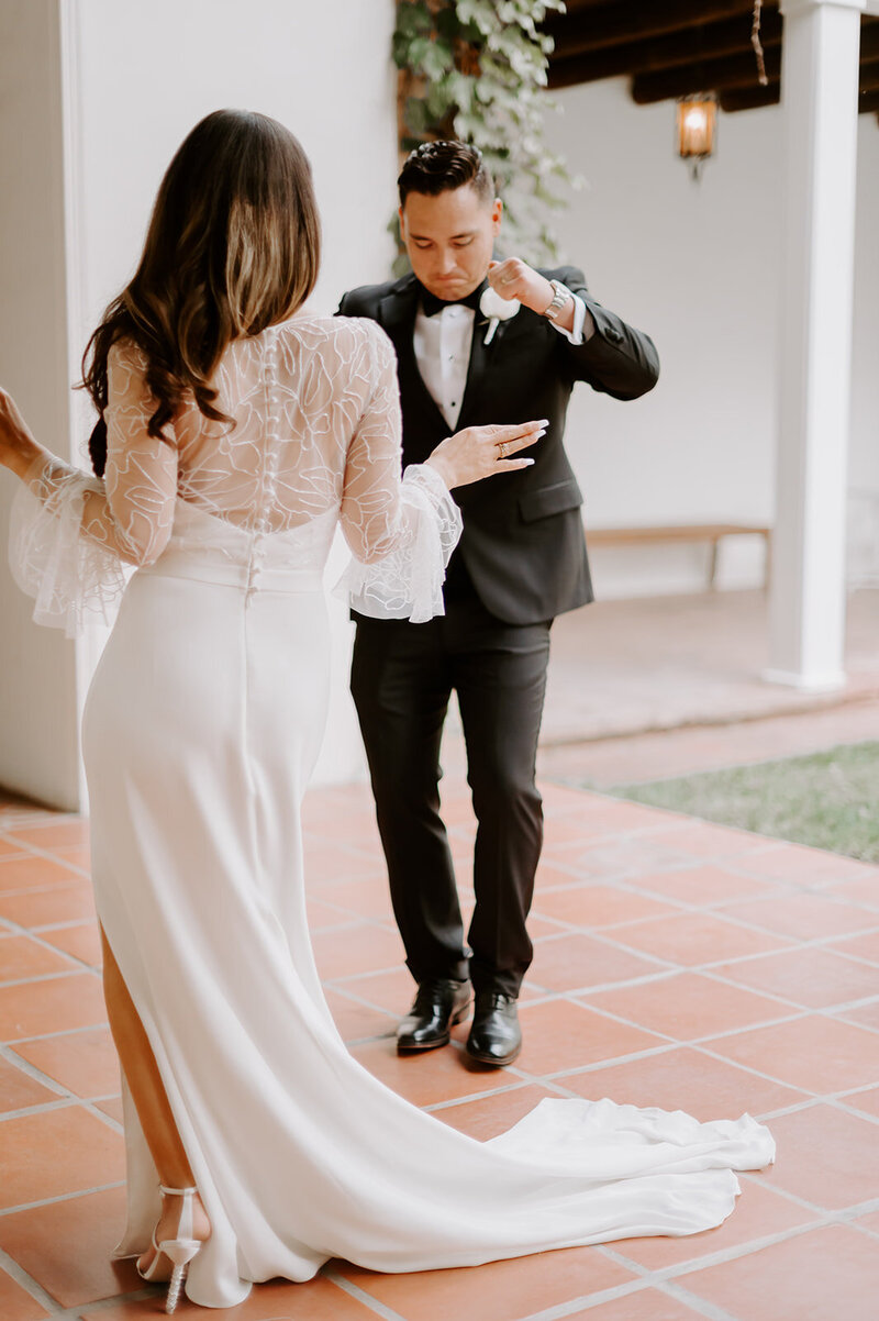 Bride and Groom kissing with cathedral in background
