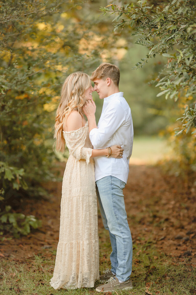 Engaged Chicago couple standing in the center, sharing a loving gaze. A timeless, romantic moment captured with elegance and warmth.