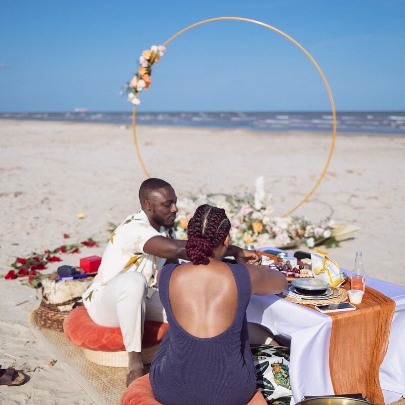 Couple enjoying luxury picnic on the beach