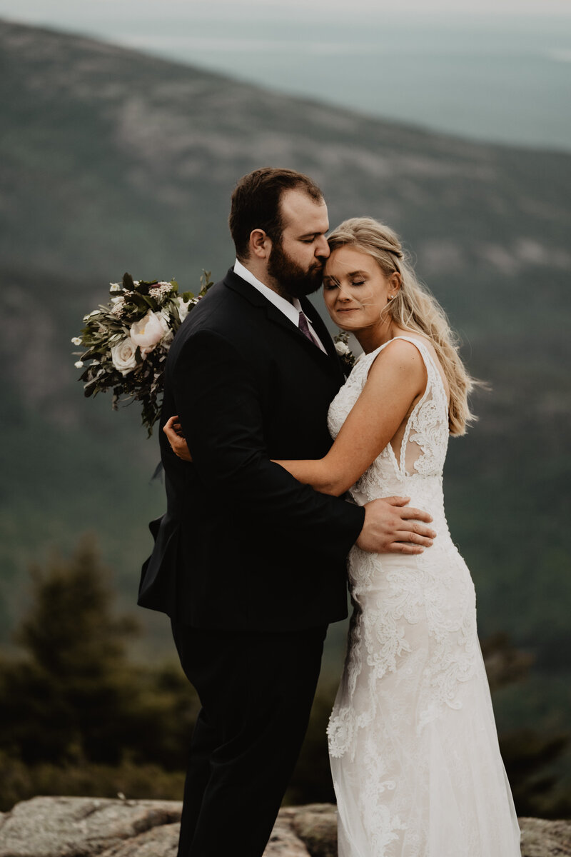 groom kissing bride