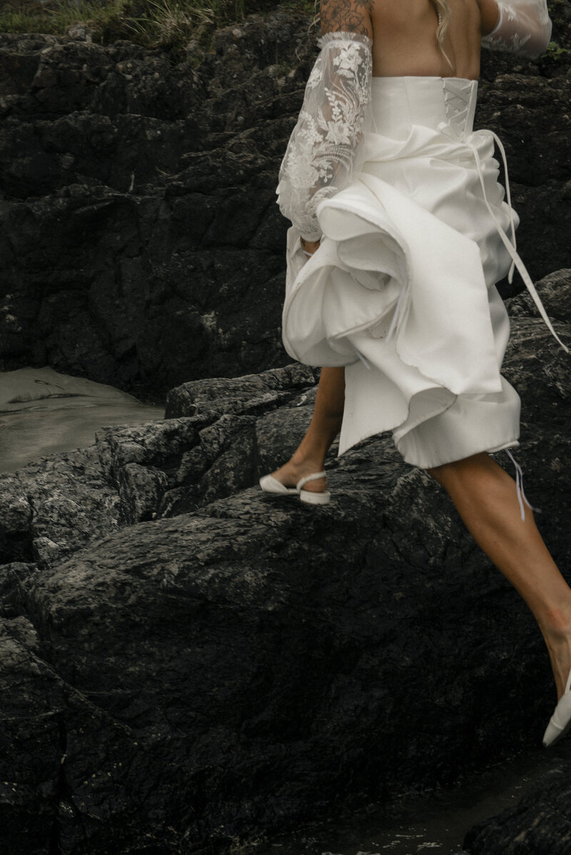 bride walking on rocks