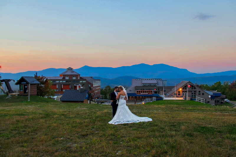 Bride and Groom with sunset and mountain in background | Sugarloaf Maine Wedding Photography