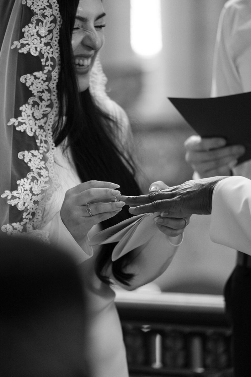 Couple wedding portrait groom holding a rose