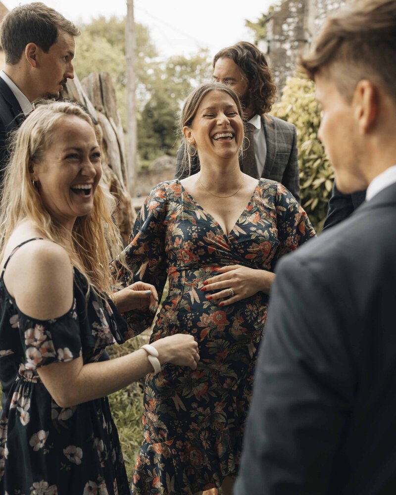 wedding guests laughing together