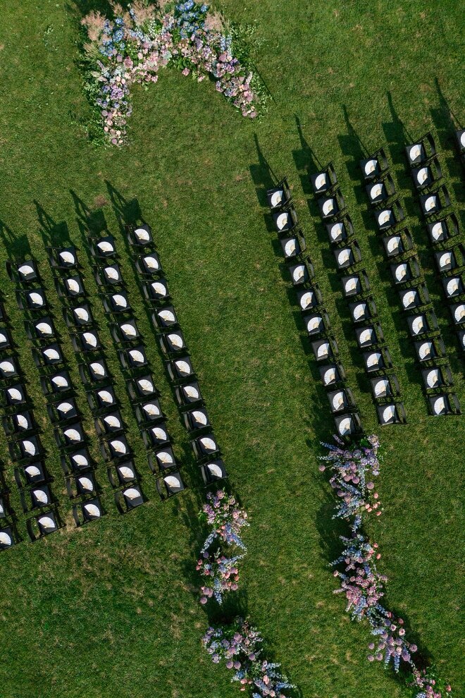 aerial view of outdoor wedding ceremony on green lawn