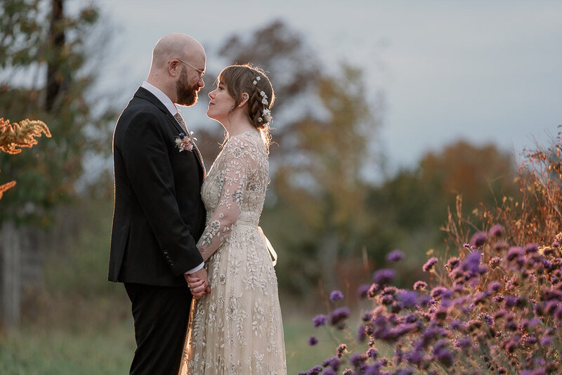Bride and Groom facing and holding each other under arch - Night shot by Brampton Wedding photographer - Sanaa Studio