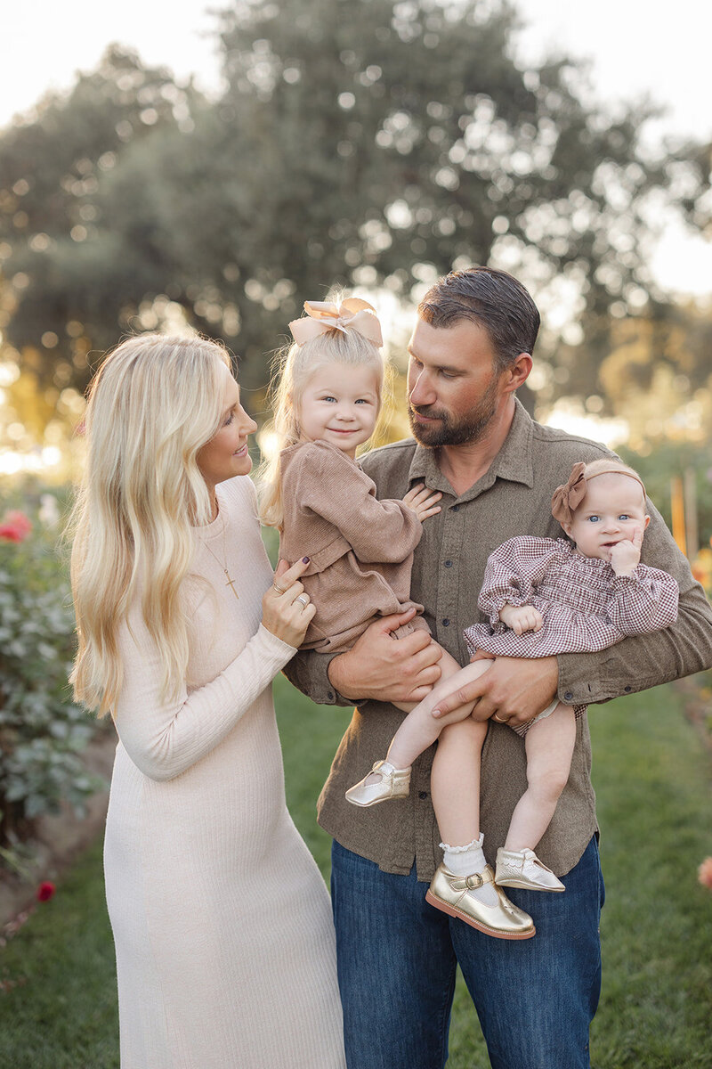 family by river for fall photo session