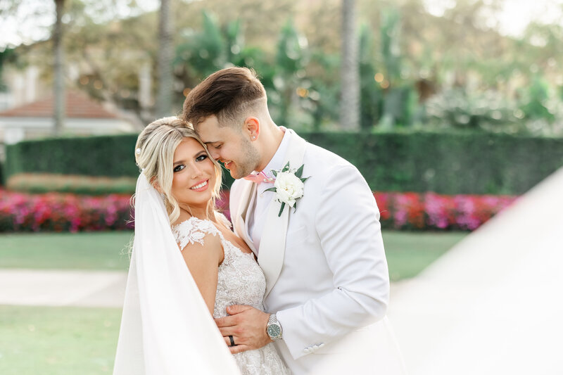 wedding image of a couple leaning toward each other by one of the best orlando wedding photographers