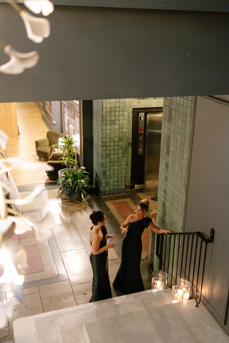 Bride holding bouquet of white roses on balcony.  at the. Westmoreland Club