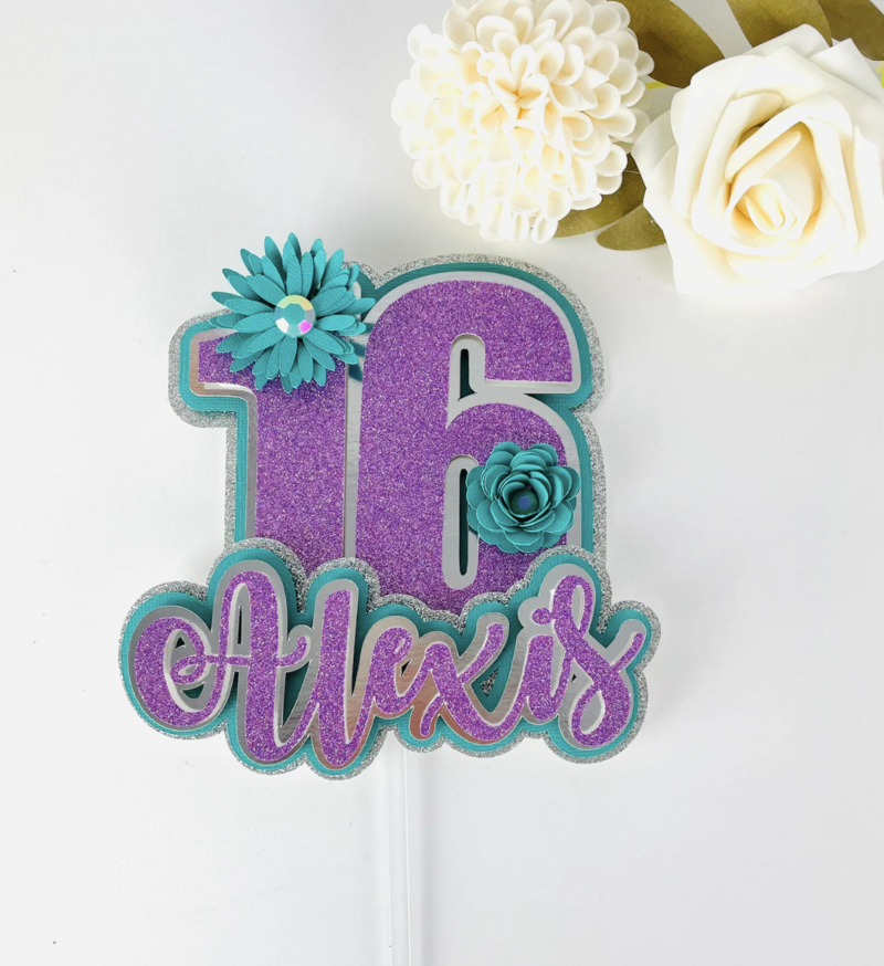 Sweet 16 Cake Topper with blue and purple glitter, blue flowers