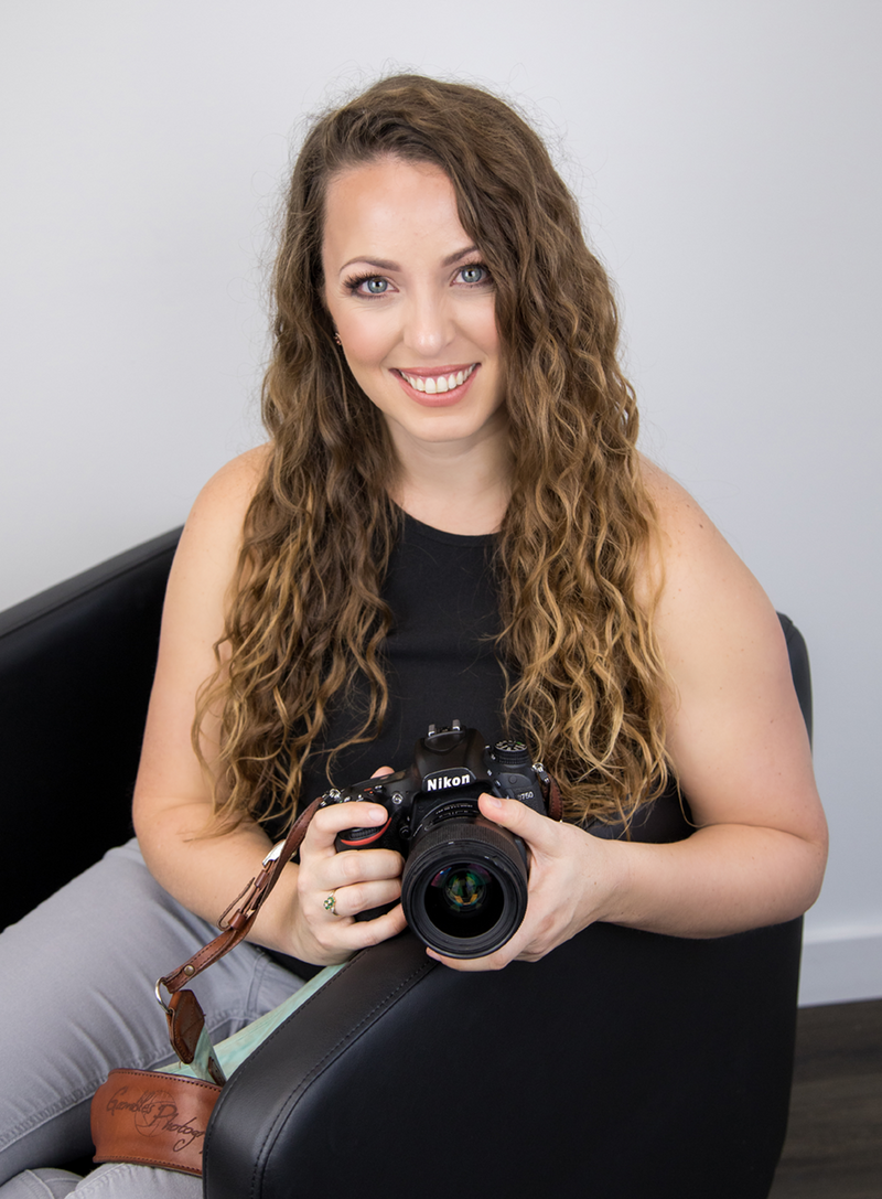 Owners of Gamble Photography near Springfield, MO, Erin and Dawn pose with their professional photographer equipment.