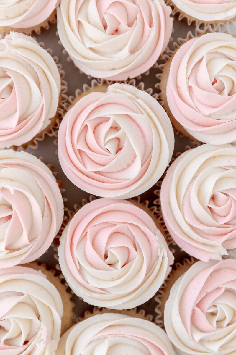 cupcakes decorated with pink and white frosting