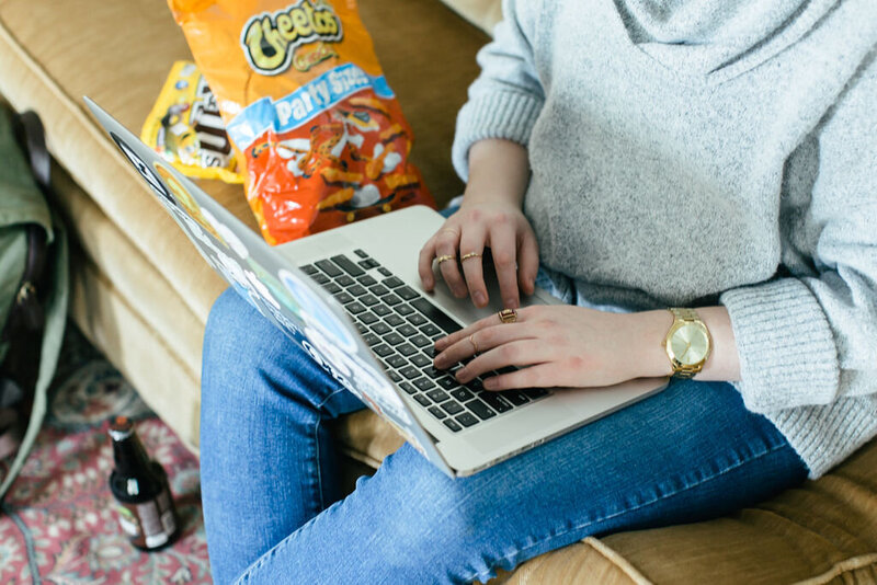 Julia editing a video and eating cheetos