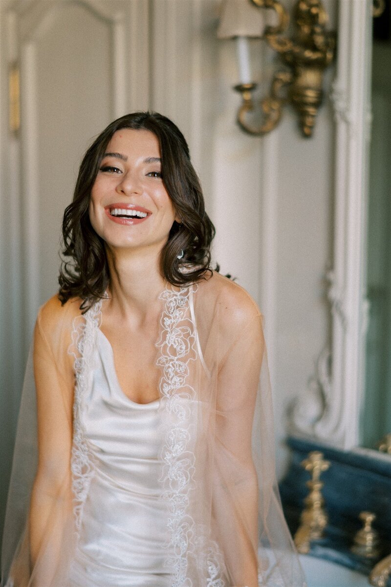 Bride smiling for her bridal photoshoot at st charles hall