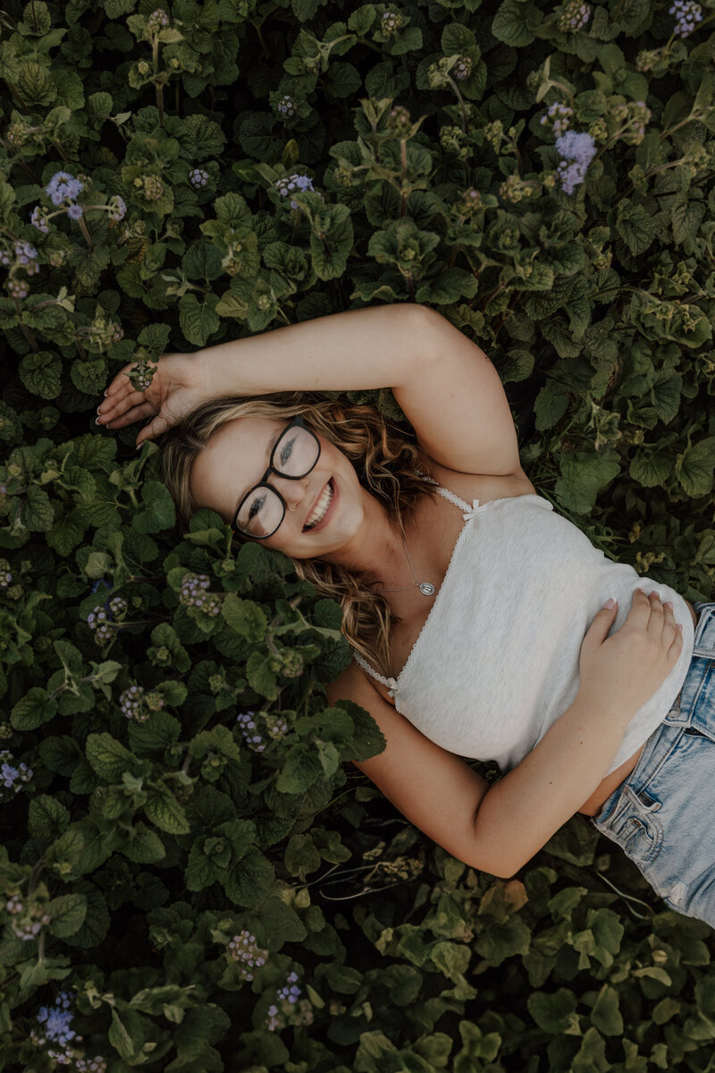 girl poses for senior photos in new hampshire