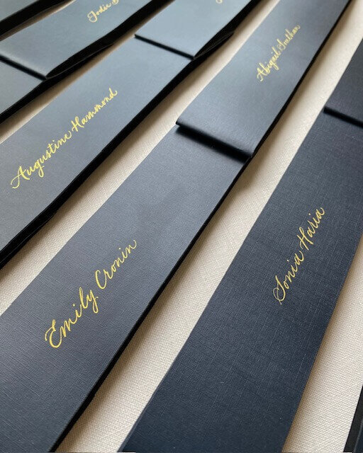 gold calligraphy names on blue advent calendars 