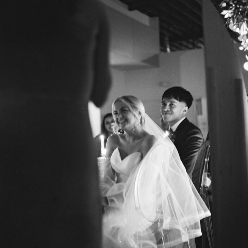 Bride laughing at speech at wedding in Tampa by film wedding photographers Noble Photo Co
