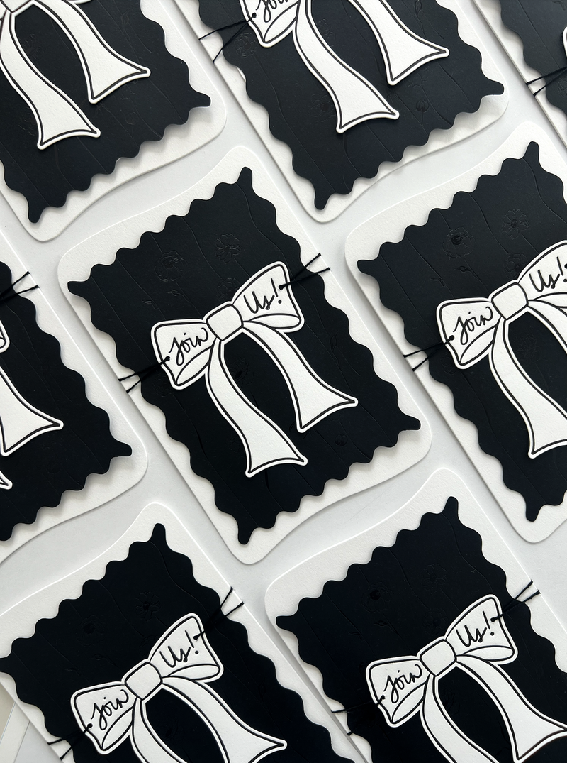 Custom wedding stationery with bows in black and white